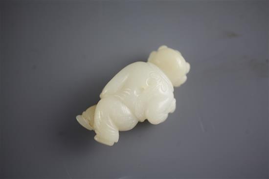 A Chinese white jade figure of a boy holding a bird, 18th/19th century, 6.2cm